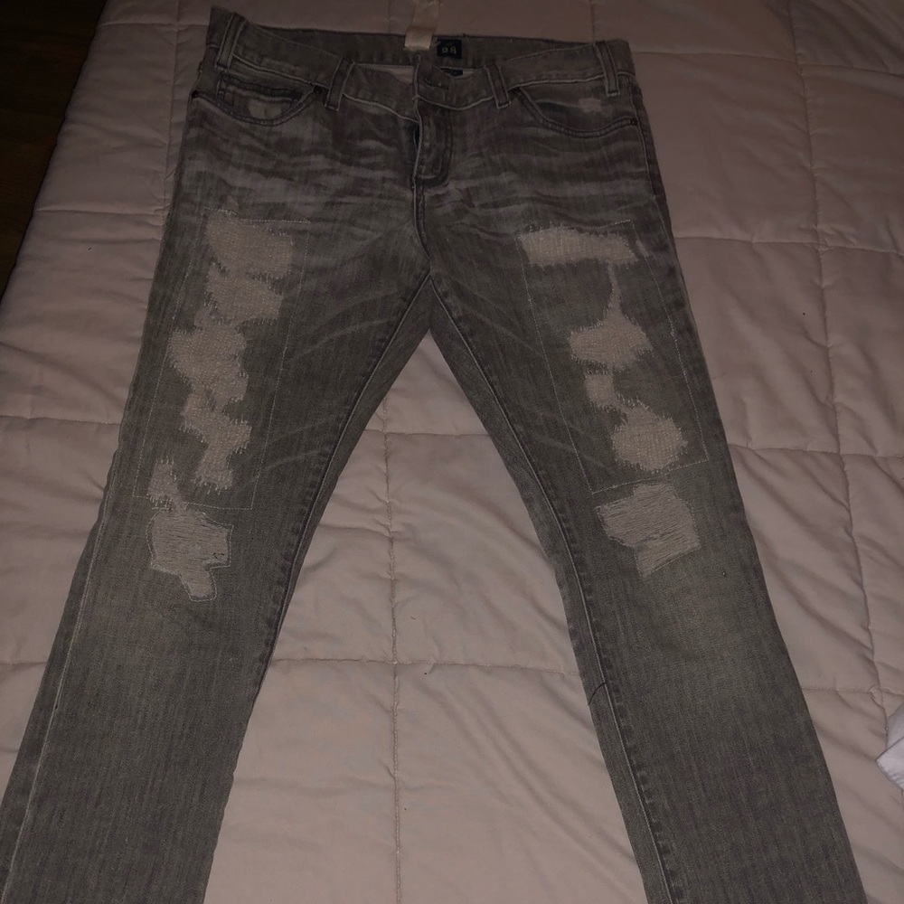 Grey distressed denim jeans